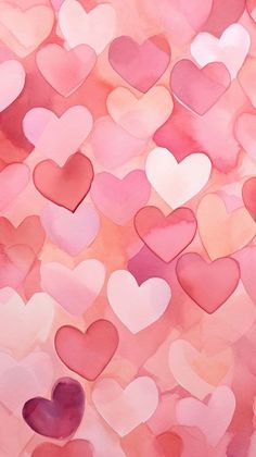 many pink and red hearts are arranged in the shape of heart shapes