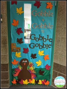 a door decorated to look like a turkey with leaves and the words gobble gobble on it