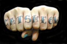 a person's hand with the word catsmeow written on it and two fingers