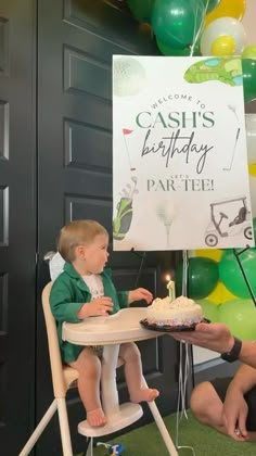 a young child sitting at a table with a birthday cake in front of him and a sign that says cash's birthday party