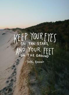 a path leading to the top of a hill with a quote about keep your eyes on the stars and your feet on the ground