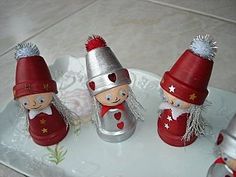 three little red and silver gnomes on a tray