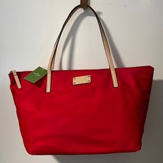 Kate Spade Nylon Tote Cherry Color Zip Closure Inside Zip Pocket Two Inside Open Pockets Inside Black And White Polkadot Pattern Gold Tone Hardware Vacchetta Leather Straps, Zipper Handle And Tag Can Be Easily Flattened And Packed. Classic Red Kate Spade Bag, Red Kate Spade Bag For Shopping, Luxury Red Kate Spade Bag, Red Nylon Shopping Bag, Red Kate Spade Shopping Bag, Kate Spade Red Crossbody Shoulder Bag, Kate Spade Backpack, Kate Spade Clutch, Kate Spade Disney