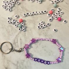 the beads and keychain are all made up of letters that spell out yoyo