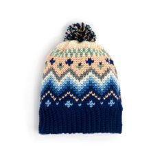 a multicolored knitted hat with pom - pom