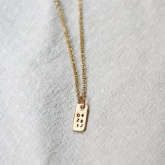 Keep your loved ones over your heart with this unique handmade piece. Customize with three lines of 2 characters - add a special date or meaningful initials. Each letter is individually hand-stamped, making each necklace one of a kind. details+ itty-bitty tag pendant measures 4mm wide x 6mm tall+ on model : 16 & 18" adjustable necklace+ s hook closure+ handmade with love in our Georgia studio availability handmade to order. ships in 5 - 14 days.current production timeline pressed for time? selec Simple Hand Stamped Necklace As Gift, Minimalist Personalized Necklace For Everyday, Everyday Personalized Minimalist Custom Necklace, Everyday Minimalist Personalized Necklace, Everyday Minimalist Customized Charm Necklaces, Minimalist Hand Stamped Jewelry For Anniversary Gift, Minimalist Hand Stamped Necklaces For Anniversary Gift, Minimalist Hand Stamped Necklace For Anniversary, Minimalist Hand Stamped Necklace For Anniversary Gift