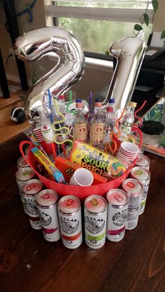 a birthday gift basket filled with sodas and condiments