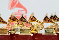 several awards are lined up in front of a wall