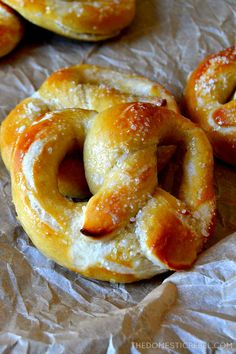 some pretzels are sitting on wax paper