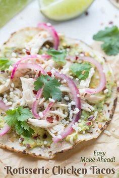 chicken tacos with cilantro, red onion and lime on tortilla