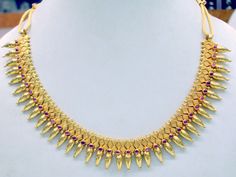 "Vintage 22 karat solid gold spiky design necklace(champakalee har) with earring pair from rajasthan india. made of solid 22 karat gold and sated ruby color stones. full handcrafted great piece for your jewelry collection. buyer will get gold test report for this item for free. total weight of set-66 grams(2.31 ounce), total lenght of necklace-18\"(we can adjust length),width of necklace-1\",material -solid 22 karat gold." Dual-tone 22k Gold Jewelry For Festivals, Festive Yellow Gold Ruby Temple Necklace, 22k Gold Temple Necklace For Formal Festivals, Formal Temple Jewelry Necklace For Festivals, Gold Ruby Temple Necklace For Diwali, Festive Yellow Gold Temple Necklace With Ruby, Yellow Gold Ruby Temple Necklace For Celebration, Formal Temple Necklace For Festivals, Formal Hallmarked Temple Necklace For Festivals