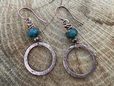 Hammered copper hoops with green gemstone. Approximately 1 1/2 inches in length. Green Wire-wrapped Dangle Hoop Earrings, Green Wire Wrapped Dangle Hoop Earrings, Green Copper Round Jewelry, Green Copper Round Bead Earrings, Green Copper Bead Earrings, Gemstone Jewelry Handmade, Beads Handmade, Hammered Copper, Crazy Lace Agate