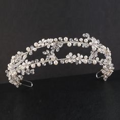 a tiara is shown on a black surface