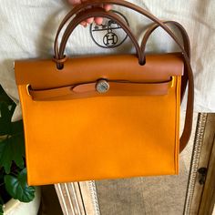 Very Gentle Used , Very Clean Inside , Very Good Condition, Details Showing Pictures Luxury Yellow Bag With Palladium Hardware, Luxury Orange Shoulder Bag With Leather Handles, Designer Orange Bag With Leather Handles, Amber Color, Hermes Bags, Color Orange, Limited Time, Amber, Bag Lady