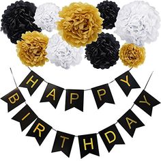 a happy birthday banner with flowers and black and gold decorations on it's side