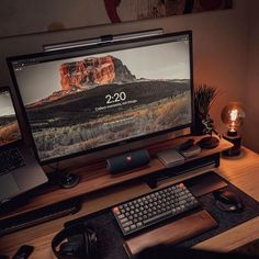 a desktop computer sitting on top of a wooden desk next to a keyboard and mouse