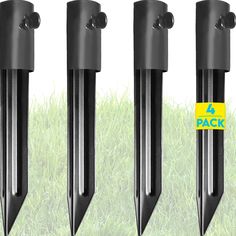 four black plastic posts in the grass with 4 pack stickers on each one side