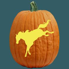 a pumpkin carved to look like a cow with the moon on it's face