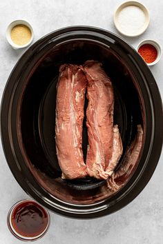 the meat is in the slow cooker ready to be put into the sauces