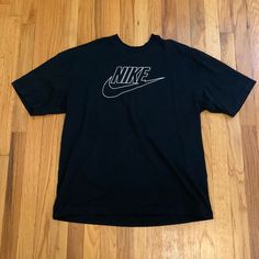 Nike T Shirt, Size M. Never Worn Nike Cotton T-shirt For Streetwear, Nike T-shirt With Text Print And Crew Neck, Nike Graphic Tee With Text Print, Black Graphic Short Sleeve Top, Black Short Sleeve Top With Graphic Design, Black Graphic Design Short Sleeve Top, Nike Black T-shirt With Letter Print, Black Nike T-shirt With Letter Print, Nike Text Print T-shirt For Streetwear