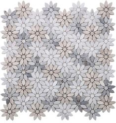 a white and grey rug with flowers on the top, in front of a white background