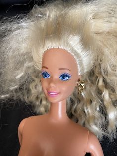 a doll with blonde hair and blue eyes