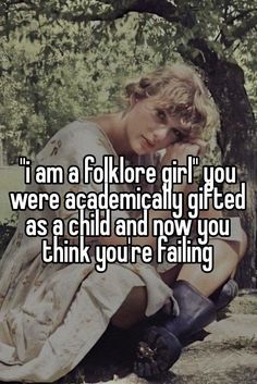 a woman sitting on the ground next to a tree with text that reads i am a folklore