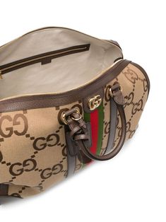 Jumbo GG duffle bag from Gucci featuring multicolour, calf leather, leather trim, gold-tone logo plaque, signature Web-stripe dial, monogram pattern, leather top handles, adjustable detachable shoulder strap, top zip fastening and main compartment. This item is in size UNI and the color is Beige Designer Duffle Bag For Shopping, Designer Top Handle Duffle Bag For Shopping, Luxury Double Handle Duffle Bag For Shopping, Designer Satchel With Gold-tone Hardware For Travel, Designer Leather Duffle Bag For Shopping, Luxury Rectangular Satchel With Logo, Luxury Duffle Bag For Shopping, Luxury Rectangular Logo Satchel, Gucci Bag With Gold-tone Hardware In Signature Coated Canvas