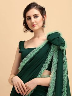 Irresistible bottle green ruffled border saree online for women which is crafted from georgette fabric and comes with georgette blouse. Festive Chiffon Saree With Ruffles, Chiffon Pre-draped Saree With Ruffles, Festive Ruffled Chiffon Saree, Festive Green Pre-draped Saree With Ruffles, Festive Georgette Dupatta With Ruffles, Festive Georgette Ruffled Dupatta, Semi-stitched Georgette Blouse Piece With Ruffles, Chiffon Saree With Ruffles In Traditional Drape, Ruffled Chiffon Saree In Traditional Drape