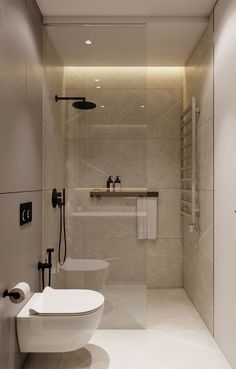 a modern bathroom with two toilets and a large mirror in the shower stall, all white