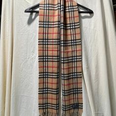 Like New. Burberry Scarf W/Original Package. Never Worn, Bag Is Open. Burberry Label Is Stitched Only On Two Sides, So I Slipped A Ruler Through The Label To Show It Is Authentic. Close Up Shots Show Quality And That It Is Not Worn Or Damaged (Just A Wrinkle Or Two From Being In Bag). Also Showing Burberry Website With Price For Similar Item New. Burberry Scarf, Burberry Accessories, Black And Tan, Ruler, The Label, Scarf Accessory, Close Up, Burberry, Mens Accessories