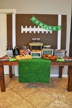 a table topped with lots of food next to a sign that says happy st patrick's day