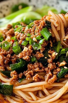 Close-up of a bowl of Dan Dan noodles topped with spicy minced pork, green onions, and sesame seeds, served with a rich, savory sauce. Don Don Noodles, Dandan Noodles Recipes, Asian Pork Noodle Recipes, Vermacheli Noodles Recipes, Asian Noodles Recipe, Dandan Noodles, Buckwheat Noodle Recipes, Dan Dan Noodles Recipe Vegetarian, Dan Dan Noodles Recipe Pf Changs