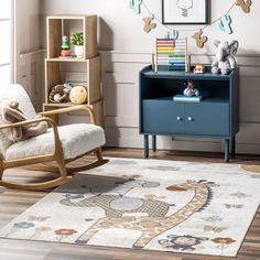 a child's room with a rocking chair, bookshelf and toy chest