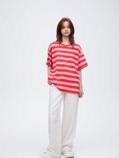 Details: Red and pink colour-blocking striped T-shirtLoose oversize fitSmall chest pocket designStrawberry embroidered label on the back Materials & Care: Cotton 100% Hand wash | Dry clean Do not bleach Size & Fit: Model is 5'7", Bust 32, Waist 24, Hips 35, wearing a size S Item #: SN1TE98 Oversized Top With Striped Hem, Spring Oversized Top With Striped Hem, Oversized Striped Hem Tops For Spring, Oversized Tops With Striped Hem For Spring, Oversized Spring Top With Striped Hem, Summer Striped Hem Relaxed Fit T-shirt, Red Short Sleeve Tops With Vertical Stripes, Summer Relaxed Fit T-shirt With Striped Hem, Relaxed Fit Striped Hem T-shirt For Summer