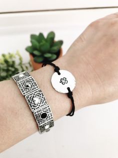 "This listing is for a boho style hand-stamped Four Leaf Clover charm with hammered edges on an adjustable hemp cord and that makes a great layering or stand-alone bracelet or anklet. Dainty and lightweight, designed for everyday wear. The bracelet comes with an inspirational card with the Four Leaf Clover Quote- \"Legend has it that each leaf on a four-leaf clover has its own meaning; the first is hope, the second for faith, the third is love and the fourth, if you can find one, is for luck!\" Silver Adjustable Bohemian Braided Bracelet, Spiritual Adjustable Hand Stamped Bracelets, Resizable Silver Friendship Bracelets For Festival, Hippie Jewelry With Adjustable Sliding Knot, Silver Resizable Friendship Bracelets For Festival, Adjustable Spiritual Hand Stamped Bracelets, Bohemian Silver Resizable Friendship Bracelets, Silver Resizable Bohemian Friendship Bracelets, Silver Bohemian Friendship Bracelets