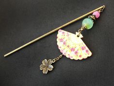 * Stick type and length: see last photo * Ornament length: 10.5cm / 4.1" * Bead type: frosted pink agate, green chalcedony * Bead size: 8mm, 12mm / 0.32", 0.47" * Fan measurements: 47mm x 28mm / 1.9" x 1.1"  * Stick type: alloy metal * Metal elements color: antique bronze > Metal stick [short] - 12.5cm / 4.9" > Metal stick [long] - 15cm / 5.9" > Wooden stick - 17.7cm / 7" * Please note that the color shade and pattern on the beads may vary due to their unique characteristics.  While I strive to Hairpin Bun, Stick Flowers, Geisha Hair, Chopstick Hair, Green Chalcedony, Unique Characteristics, Pink Agate, Hair Stick, Photo Ornaments