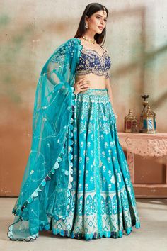 Go for a beautiful traditional look at weddings in this exquisite sea green embroidered Banarasi silk lehenga with blue embroidered blouse. The lehenga comes with a beautiful dupatta. Beautiful Dupatta, Tussar Silk Sarees, Indian Clothing Store, Lehenga Online, Fashion Journals, Tussar Silk Saree, Indian Clothing, Traditional Fabric, Silk Lehenga