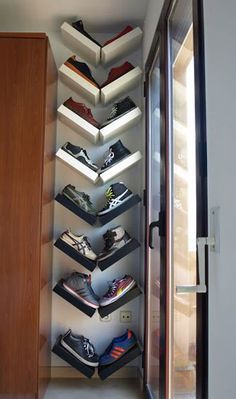 there is a shoe rack in the hallway