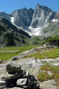 rocks stacked on top of each other with mountains in the background