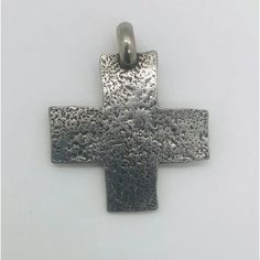 This stunning set of six handcrafted antique cross pendants showcases unique styles inspired by Native American design, all made from sterling silver. Each piece is attributed to T. Foree, though they are not signed by the designer.  Dimensions: Largest Cross: 3.75" H x 1.75" W Artisan Hand Forged Cross Jewelry, Handmade Symbolic Crucifix Jewelry, Oxidized Cross Pendant Necklace, Sterling Silver Oxidized Crucifix Necklace, Oxidized Sterling Silver Cross Pendant Necklace, Handmade Sterling Silver Cross Pendant Necklace, Gift Sterling Silver Cross Necklace With Oxidized Finish, Antique Silver Cross Symbolic Jewelry, Antique Silver Symbolic Cross Jewelry