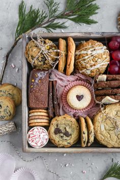 a box filled with cookies and pastries on top of a table