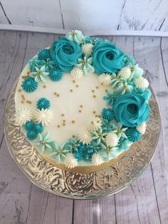 a cake decorated with blue and white flowers