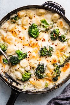 broccoli and cauliflower casserole in a cast iron skillet