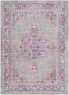 a rug with an ornate design on the front and back side, in grey tones