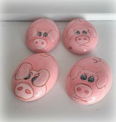 four pink pigs painted on top of each other