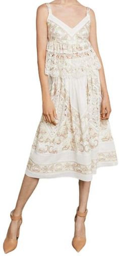 Designed with a flattering sweetheart neckline, this sleeveless, lingerie-inspired top in floral filigree on cotton voile is embellished with an ornately embroidered hemline.Concealed center back zipper and hook-and-eye closuresAdjustable spaghetti strapsFabric Self: 100% cotton filigree floral embroidered voile;Lining: 100% polyester crepe de chineHand wash Feminine Lace Patchwork Top For Summer, Feminine Lace Top With Lace Patchwork For Summer, Elegant Summer Cotton Lace Top, Elegant Summer Lace Top In Cotton Lace, Elegant Cotton Lace Top For Summer, Feminine Cotton Lace Patchwork Top, Feminine Cotton Lace Top For Spring, Elegant Spring Cotton Lace Top, Elegant Cotton Lace Top For Spring