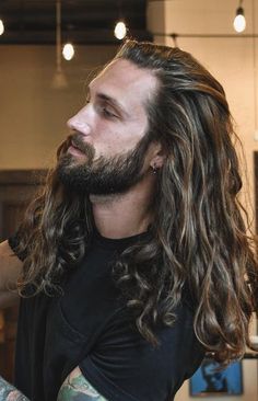 Long Dark Hair Men Aesthetic, Mens Long Hair With Hat, Men With Long Dark Hair, Guy With Long Hair And Beard, Tattooed Long Haired Men, Wild Long Hair, Men Long Hair Highlights, Long Haired Bearded Men, Men With Really Long Hair