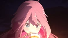 a girl with pink hair drinking from a cup