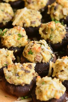 stuffed mushrooms are topped with cheese and parsley